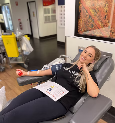 Chloe from Connected Media Group donating blood